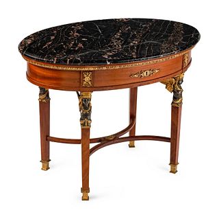 An Empire Style Bronze-Mounted Mahogany Oval Occasional Table
Height 26 x length 35  x depth 23 inches.