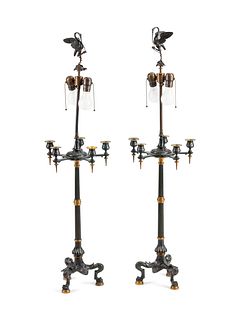 A Pair of French Parcel-Gilt and Patinated Bronze Lamps
Height 38 x width 23 1/2 x depth 5 1/2 inches.