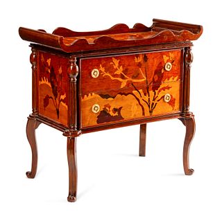 An Art Nouveau Style Inlaid Chest of Drawers
Height 37 x length 39 x depth 18 1/2 inches.