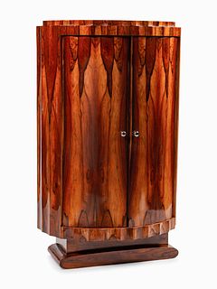 An Art Deco Style Rosewood Cabinet
Height 63 1/2 x width 39 1/2 x depth 17 1/2 inches.