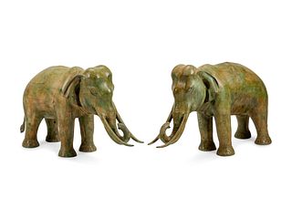 A Large Pair of Patinated Bronze Elephants
Height 24 x length 41 x depth 14 inches.