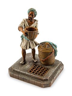 An Austrian Cold-Painted Bronze Figure of a Man With a Jug
Height 6 1/2 x width 5 x depth 4 1/2 inches.