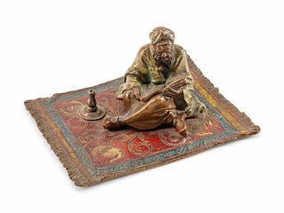 An Austrian Cold-Painted Bronze Figure of a Man Reading the Koran
Height 2 x length 4 1/2 x depth 3 1/2 inches.