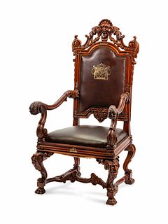 An Italian Baroque Style Leather-Upholstered Carved Walnut Armchair
Height 58 1/2 x width 30 x depth 27 1/2 inches.