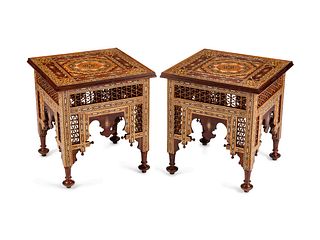 A Pair of Moorish Style Inlaid Mixed Wood Side Tables
Height 26 1/2 x width 24 1/2 x depth 24 1/2 inches.