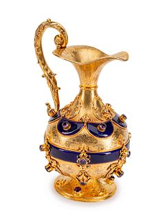 A Continental Jeweled, Enamel and Silvergilt Ewer
Height 9 x width 7 x depth 5 inches.