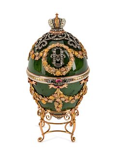 A Diamond and Gold-Mounted  Enamel and Jadeite Egg
Height 5 x width 2 1/2 inches.
