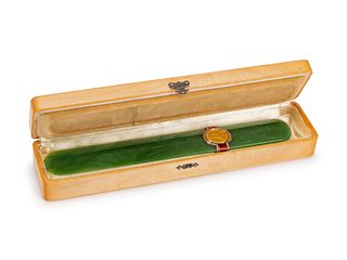 A Gold, Diamond and Enamel-Mounted Spinach Jade Letter Opener
10 x 1 1/2 inches.