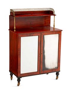 A Regency Brass-Mounted Rosewood Chiffonier
Height 47 1/2 x width 31 x depth 15 1/2 inches.
