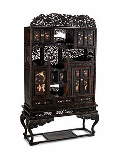 A Japanese Bone-Mounted Pierce-Carved Hardwood Cabinet on Stand
Height 78 x width 48 x depth 18 inches.