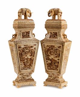 A Pair of Japanese Bone-Veneered Covered Vases on Stands
Height 30 x width 10 1/2 x depth 6 inches.