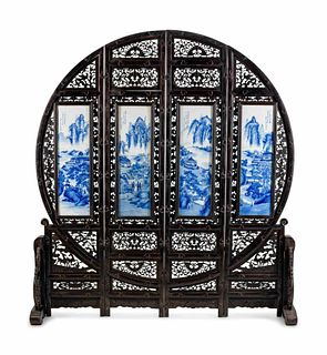 A Chinese Blue and White Porcelain-Mounted Carved Hardwood Four Panel Floor Screen 
Height 76 1/2 x width 70 x depth 17 1/2 inches.