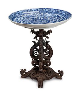 A Chinese Carved Wood Circular Table
Height 35 x diameter 30 1/2 inches.