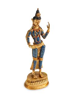A Tibetan Jeweled Bronze and Sodalite Figure of a Deity
Height 18 1/2 x width 6 x depth 4 inches.