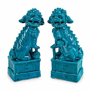 A Pair of Chinese Turquoise-Glazed Pottery Figures of Fu-Lions
Height 19 x width 5 x depth 9 inches.