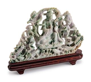 A Large Burmese Jade Figure of Guanyin
Height 10 1/2 x length 13 x depth 2 inches.