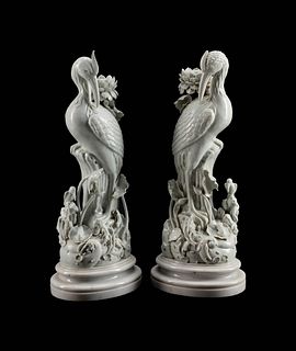 A Pair of Chinese Blanc de Chine Porcelain Crane-Form Candlesticks
Height 22 x width 9 x depth 7 inches.
