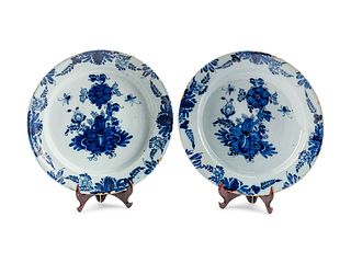 A Pair of Delft Tin-Glazed Earthenware Chargers 
Height 2 1/4 x diameter 13 1/2 inches.