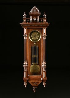 AN ANTIQUE BRASS AND CARVED WALNUT REGULATOR WALL CLOCK, POSSIBLY AUSTRIAN, LATE 19TH CENTURY,