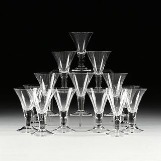A SET OF FOURTEEN MODERN CLEAR SHERRY GLASSES,
