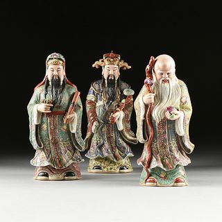 A GROUP OF THREE CHINESE FAMILLE ROSE PARCEL GILT PORCELAIN FIGURES OF THE THREE IMMORTALS, EARLY 20TH CENTURY,