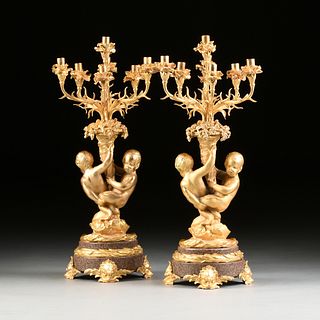 A PAIR OF PALATIAL LOUIS XV STYLE GILT BRONZE AND GRANITE SEVEN LIGHT FIGURAL CANDELABRAS, 20TH CENTURY, 