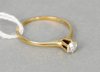 14 karat yellow gold and diamond engagement ring set with center diamond approximately .20 carats, size 6.5.