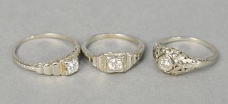 Three 18 karat white gold rings set with diamonds, 7.5 grams total weight, sizes 5.5, 8, 4.5.