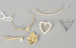 Four piece lot of four pins to include 14 karat gold leaf, heart with pearls and pearl, and pearl crecini pin, also a 10 karat V pin pearls and blue s