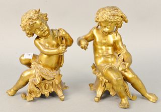 Pair French style bronze putti figures both in seated position, ht. 10 1/2".