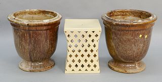 Three piece lot to include pair of glazed outdoor urns, ht. 21" along with glazed pottery stool with pierced sides, ht. 17". Estate of Marilyn Ware St