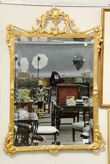 Chippendale style gold framed mirror with beveled mirror, 41" x 29".