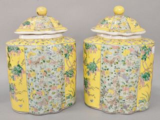 Pair of large Chinese Famille Juane tea caddies having yellow grain with painted grapes, butterflies and animals throughout the jar and cover, ht. 14"