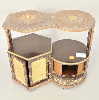 Japanese black lacquered cabinet having lotus form top and two part cabinet having two doors and one drawer, painted with gilt gold flowers along with
