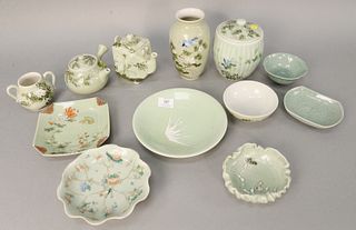 Twelve Chinese porcelain painted and celadon glazed, to include covered jar, teapot, vase, plates, footed dish, etc., tallest ht. 7 1/4". Provenance: 