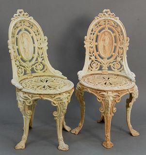 Pair iron outdoor chairs with medallion backs and rams head on legs, ht. 36".