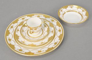 Minton fifty-seven piece porcelain partial set, G9902 pattern, having gold encrusted floral and dotted swags, to include 2 dinner plates, 14 luncheon 
