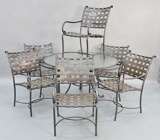 Eight piece Brown & Jordan outdoor patio set having round glass top table along with four armchairs, ht. 28", dia. 50". Estate of Marilyn Ware Strasbu