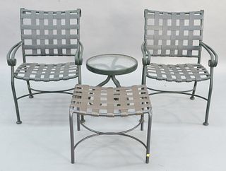 Four piece Brown & Jordan outdoor lot to include a pair of armchairs along with a glass top side table and ottoman. Estate of Marilyn Ware Strasburg, 