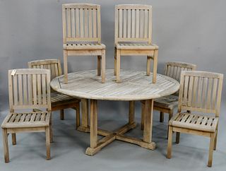 Seven piece outdoor teak set, includes: Outdoor Classics round dining table, ht. 28 3/4", dia. 59"; and six Rockwood chairs, ht. 34 1/2", wd. 18", sea