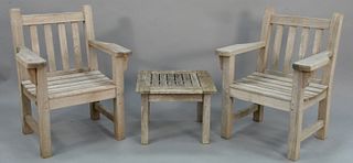 Barlow Tyrie three piece teak outdoor lot to include two armchairs and one small table, ht. 35", wd. 27".