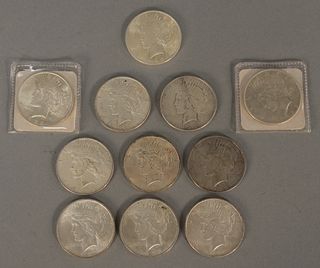 Group of eleven silver dollars to include 1922, 1923, 1924 and 1925. Provenance: Ida Cion Estate 1989, sold Nadeau’s Auction Gallery 1989, Estate of H