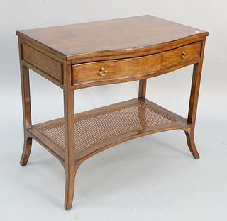 Georgian style mahogany bowfront side table having a caned shelf stretcher, ht. 30", wd. 34".
