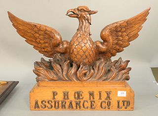 Carved oak American eagle, wings spread over flaming base, Phoenix Assurance Co, ht: 17 1/4" wd: 26".