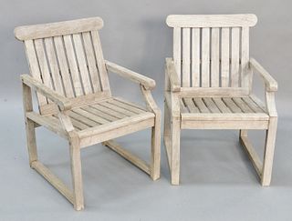 Pair of teak outdoor armchairs.
