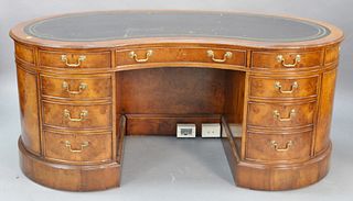 Kidney shaped executive desk having tooled leather top, ht. 30", top 35" x 72".