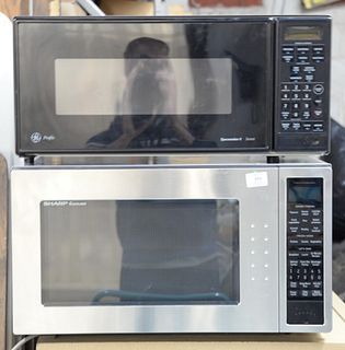 Two microwaves: GE Profile Spacemaker II and Sharp Carousel.