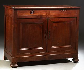 French Provincial Carved Cherry Louis Philippe Sideboard, 19th c., the canted corner top over two frieze drawers and double cupboard...