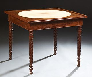 French Louis Philippe Carved Mahogany Games Table, 19th c., the top with an inset gilt tooled baize top, over a wide skirt, on turne...