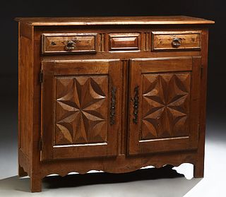 French Provincial Louis XV Style Carved Oak Sideboard, 19th c., the rounded edge three board top over two frieze drawers and two cup...